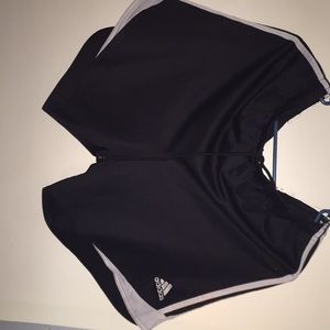 Black and white adidas athletic shorts.